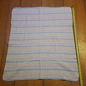 Homemade blanket with strips.